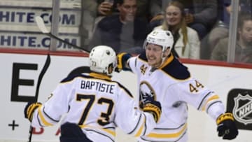 Oct 20, 2016; Vancouver, British Columbia, CAN; Buffalo Sabres forward Nicolas Deslauriers (44) celebrates his goal withforward Nicholas Baptiste (73) against Vancouver Canucks goaltender Jacob Markstrom (25) during the third period at Rogers Arena. The Vancouver Canucks won 2-1. Mandatory Credit: Anne-Marie Sorvin-USA TODAY Sports