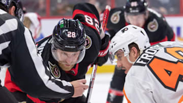 Mar 30, 2023; Ottawa, Ontario, CAN; Ottawa Senators right wing Claude Giroux (28) faces off against Philadelphia Flyers center Morgan Frost (48) in the second period at the Canadian Tire Centre. Mandatory Credit: Marc DesRosiers-USA TODAY Sports