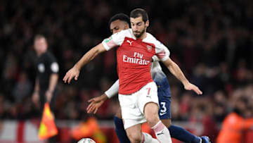 LONDON, ENGLAND - DECEMBER 19: Henrikh Mkhitaryan of Arsenal is challenged by Danny Rose of Tottenham Hotspur during the Carabao Cup Quarter Final match between Arsenal and Tottenham Hotspur at Emirates Stadium on December 19, 2018 in London, United Kingdom. (Photo by Shaun Botterill/Getty Images)