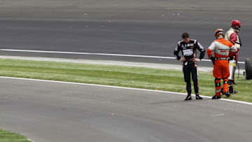 INDIANAPOLIS - MAY 29: J.R. Hildebrand driver of the #4 National Guard Panther Racing stands on the track after finishing second due to a last-lap crash during the IZOD IndyCar Series Indianapolis 500 Mile Race, as at Indianapolis Motor Speedway on May 29, 2011 in Indianapolis, Indiana. (Photo by Todd Warshaw/Getty Images)