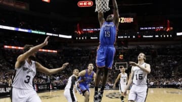 Jan 22, 2014; San Antonio, TX, USA; Oklahoma City Thunder guard Reggie Jackson (15) dunks during the second half against the San Antonio Spurs at AT&T Center. The Thunder won 111-105. Mandatory Credit: Soobum Im-USA TODAY Sports