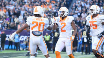 Dec 30, 2021; Nashville, TN, USA; Tennessee Volunteers running back Jaylen Wright (20) celebrates the touchdown of running back Jabari Small (2) against the Purdue Boilermakers during the first half at Nissan Stadium. Mandatory Credit: Steve Roberts-USA TODAY Sports