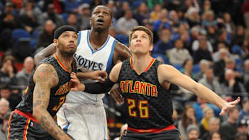 Dec 26, 2016; Minneapolis, MN, USA; Atlanta Hawks forward Mike Scott (32) and guard Kyle Korver (26) box out Minnesota Timberwolves forward Gorgui Dieng (5) in the first quarter at Target Center. Mandatory Credit: Marilyn Indahl-USA TODAY Sports