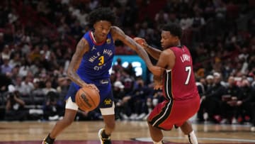 Denver Nuggets guard Bones Hyland (3) commits an offensive foul on Miami Heat guard Kyle Lowry (7)(Jasen Vinlove-USA TODAY Sports)