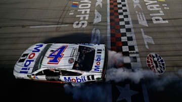 FORT WORTH, TX - NOVEMBER 04: Kevin Harvick, driver of the #4 Mobil 1 Ford, celebrates with a burnout after winning the Monster Energy NASCAR Cup Series AAA Texas 500 at Texas Motor Speedway on November 4, 2018 in Fort Worth, Texas. (Photo by Matt Sullivan/Getty Images)