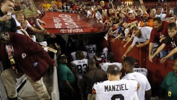 Aug 18, 2014; Landover, MD, USA; Cleveland Browns quarterback Johnny Manziel (2) walks off the field after the Browns game against the Washington Redskins at FedEx Field. The Redskins won 24-23. Mandatory Credit: Geoff Burke-USA TODAY Sports