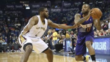 Apr 9, 2014; New Orleans, LA, USA; Phoenix Suns forward P.J. Tucker (17) is defended by New Orleans Pelicans forward Darius Miller (2) in the first half at Smoothie King Center. Mandatory Credit: Crystal LoGiudice-USA TODAY Sports