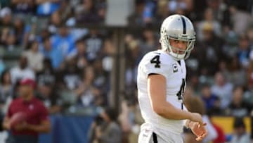 CARSON, CA - DECEMBER 31: Derek Carr #4 of the Oakland Raiders reacts after an offensive penalty during the second quarter of the game against the Los Angeles Chargers at StubHub Center on December 31, 2017 in Carson, California. (Photo by Harry How/Getty Images)