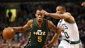 Feb 29, 2016; Boston, MA, USA; Utah Jazz guard Rodney Hood (5) drives to the basket against Boston Celtics guard Avery Bradley (0) during the second half at TD Garden. Mandatory Credit: Mark L. Baer-USA TODAY Sports