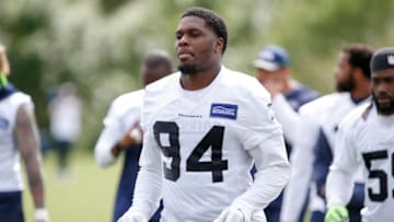 Jun 13, 2017; Renton, WA, USA; Seattle Seahawks defensive tackle Malik McDowell (94) carries helmets back to the locker room following a minicamp practice at the Virginia Mason Athletic Center. Mandatory Credit: Joe Nicholson-USA TODAY Sports