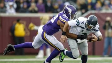 Dec 6, 2015; Minneapolis, MN, USA; Minnesota Vikings defensive end Danielle Hunter (99) sacks Seattle Seahawks quarterback Russell Wilson (3) in the second quarter at TCF Bank Stadium. The Seahawks defeated the Vikings 38-7. Mandatory Credit: Bruce Kluckhohn-USA TODAY Sports