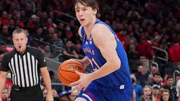 ELMONT, NY - DECEMBER 3: Zach Clemence #21 of the Kansas Jayhawks dribbles the ball against the St. John's Red Storm during the Big East/Big12 Battle at UBS Arena on December 3, 2021 in Elmont, NY. (Photo by Porter Binks/Getty Images)