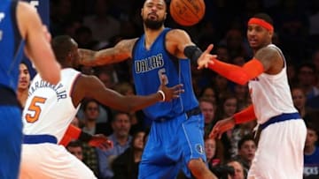 Dec 16, 2014; New York, NY, USA; Dallas Mavericks center Tyson Chandler (6) fights for a rebound with New York Knicks shooting guard Tim Hardaway Jr. (5) and New York Knicks small forward Carmelo Anthony (7) during the third quarter at Madison Square Garden. The Mavericks defeated the Knicks 107-87. Mandatory Credit: Brad Penner-USA TODAY Sports