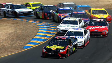 SONOMA, CA - JUNE 24: Martin Truex Jr., driver of the #78 5-hour ENERGY/Bass Pro Shops Toyota, races Kevin Harvick, driver of the #4 Mobil 1 Ford (Photo by Sean Gardner/Getty Images)