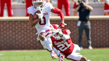 Apr 24, 2021; Norman, Oklahoma, USA; Oklahoma Sooners running back Eric Gray (0) runs with the ball as Oklahoma Sooners cornerback Kendall Dennis (21) defends during the spring game at Gaylord Family-Oklahoma Memorial Stadium. Mandatory Credit: Kevin Jairaj-USA TODAY Sports