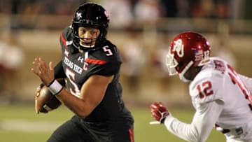 Oct 22, 2016; Lubbock, TX, USA; Texas Tech Red Raiders quarterback Patrick Mahomes (5) rushes against Oklahoma Sooners defensive back Will Johnson (12) at Jones AT&T Stadium. Mandatory Credit: Michael C. Johnson-USA TODAY Sports