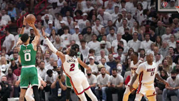 Boston Celtics forward Jayson Tatum (0) takes a shot over Miami Heat guard Gabe Vincent (2)(Jasen Vinlove-USA TODAY Sports)