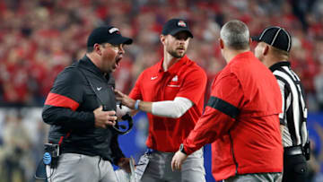 GLENDALE, ARIZONA - DECEMBER 28: Head coach Ryan Day of the Ohio State Buckeyes (L) argues a call with an official during the first half of the College Football Playoff Semifinal against the Clemson Tigers at the PlayStation Fiesta Bowl at State Farm Stadium on December 28, 2019 in Glendale, Arizona. (Photo by Ralph Freso/Getty Images)