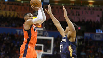 Dec 4, 2016; Oklahoma City, OK, USA; Oklahoma City Thunder guard Russell Westbrook (0) shoots the ball over New Orleans Pelicans guard Jrue Holiday (11) during the fourth quarter at Chesapeake Energy Arena. Mandatory Credit: Mark D. Smith-USA TODAY Sports