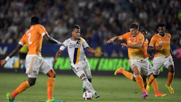 Jul 15, 2016; Carson, CA, USA; LA Galaxy forward Giovani dos Santos (10) dribbles the ball against the Houston Dynamo during a MLS soccer game at StubHub Center. The Galaxy defeated the Dynamo 1-0. Mandatory Credit: Kirby Lee-USA TODAY Sports