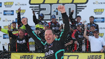 DOVER, DE - MAY 03: Johnny Sauter, NASCAR Truck Series driver of the #13 Tenda Heal ThorSport Racing Ford, celebrates after winning the 2019 JEGS 200 at Dover International Speedway (Photo by Matt Sullivan/Getty Images)