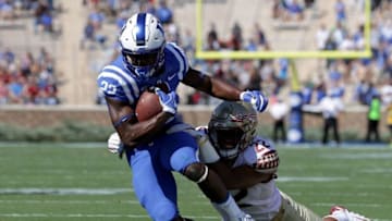 DURHAM, NC - OCTOBER 14: Adonis Thomas #22 of the Florida State Seminoles tackles Brittain Brown #22 of the Duke Blue Devils during their game at Wallace Wade Stadium on October 14, 2017 in Durham, North Carolina. (Photo by Streeter Lecka/Getty Images)