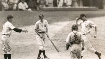 UNSPECIFIED - UNDATED: Joe Dimaggio at home plate after hitting safely in his 45th straight game, a new record. (Sports Studio Photos/Getty Images)