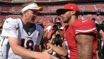 Aug 17, 2014; Santa Clara, CA, USA; Denver Broncos quarterback Peyton Manning (18) and San Francisco 49ers quarterback Colin Kaepernick (7) shake hands after the inaugural football game at Levi
