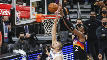 PHOENIX, ARIZONA - JUNE 22: Deandre Ayton #22 of the Phoenix Suns dunks the ball over Ivica Zubac #40 of the LA Clippers during the fourth quarter in game two of the NBA Western Conference finals in-which the Phoenix Suns defeated the LA Clippers 104-103 at Phoenix Suns Arena on June 22, 2021 in Phoenix, Arizona. NOTE TO USER: User expressly acknowledges and agrees that, by downloading and or using this photograph, User is consenting to the terms and conditions of the Getty Images License Agreement. (Photo by Christian Petersen/Getty Images)