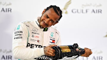 BAHRAIN, BAHRAIN - MARCH 31: Race winner Lewis Hamilton of Great Britain and Mercedes GP celebrates on the podium during the F1 Grand Prix of Bahrain at Bahrain International Circuit on March 31, 2019 in Bahrain, Bahrain. (Photo by Clive Mason/Getty Images)