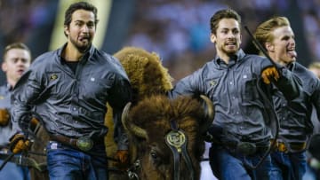 DENVER, CO - AUGUST 31: Handlers for the Colorado Buffaloes mascot "Ralphie" run across the field before a football game against Colorado State Rams at Broncos Stadium at Mile High on August 31, 2018 in Denver, Colorado. (Photo by Joe Mahoney/Getty Images)