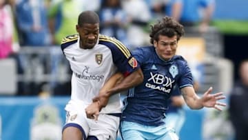 Oct 23, 2016; Seattle, WA, USA; Real Salt Lake defender Chris Schuler (28) holds onto Seattle Sounders FC forward Nelson Valdez (16) during the second half at CenturyLink Field. Seattle won 2-1. Mandatory Credit: Jennifer Buchanan-USA TODAY Sports