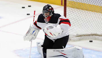 UNIONDALE, NEW YORK - JANUARY 21: Eric Comrie #1 of the New Jersey Devils skates in warm-ups prior to the game against the New York Islanders at Nassau Coliseum on January 21, 2021 in Uniondale, New York. (Photo by Bruce Bennett/Getty Images)