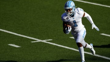 CHESTNUT HILL, MASSACHUSETTS - OCTOBER 03: Khafre Brown #1 of the North Carolina Tar Heels runs the ball in for a touchdown against the Boston College Eagles at Alumni Stadium on October 03, 2020 in Chestnut Hill, Massachusetts. (Photo by Maddie Meyer/Getty Images)