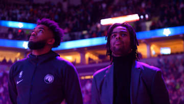 MINNEAPOLIS, MN - FEBRUARY 8: Minnesota Timberwolves center Karl-Anthony Towns (32) stood beside guard D'Angelo Russell (0) for the national anthem. (Photo by Aaron Lavinsky/Star Tribune via Getty Images)