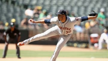 OAKLAND, CA - JUNE 14: Hector Rondon #30 of the Houston Astros pitches against the Oakland Athletics in the ninth inning at Oakland Alameda Coliseum on June 14, 2018 in Oakland, California. (Photo by Ezra Shaw/Getty Images)