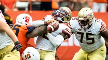 SYRACUSE, NY - SEPTEMBER 15: Deondre Francois #12 of the Florida State Seminoles is sacked by Chris Slayton #95 of the Syracuse Orange during the second half at the Carrier Dome on September 15, 2018 in Syracuse, New York. Syracuse defeats Florida State 30-7. (Photo by Brett Carlsen/Getty Images)