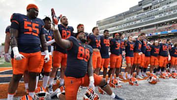 Sep 10, 2022; Champaign, Illinois, USA; Illinois Fighting Illini defensive lineman Keith Randolph Jr. (88) and teammates celebrate Saturday’s 24-3 win over the Virginia Cavaliers at Memorial Stadium. Mandatory Credit: Ron Johnson-USA TODAY Sports
