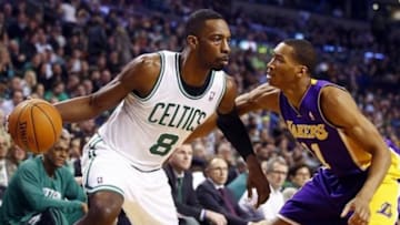 Jan 17, 2014; Boston, MA, USA; Boston Celtics small forward Jeff Green (8) works the ball against Los Angeles Lakers shooting guard Wesley Johnson (11) in the first quarter at TD Garden. Mandatory Credit: David Butler II-USA TODAY Sports