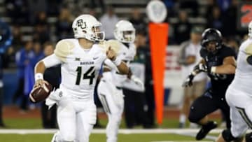 Sep 12, 2014; Buffalo, NY, USA; Baylor Bears quarterback Bryce Petty (14) scrambles out of the pocket during the second half against the Buffalo Bulls at University of Buffalo Stadium. Baylor beat Buffalo 63-21. Mandatory Credit: Kevin Hoffman-USA TODAY Sports
