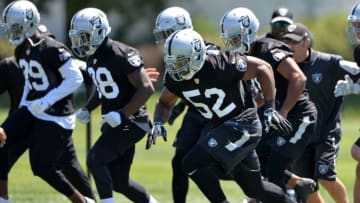 Jun 15, 2016; Alameda, CA, USA; Oakland Raiders defensive end Khalil Mack (52), cornerback T.J. Carrie (38) and cornerback David Amerson (29) at minicamp at the Raiders practice facility. Mandatory Credit: Kirby Lee-USA TODAY Sports