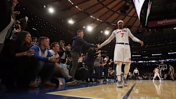 Dec 20, 2016; New York, NY, USA; New York Knicks forward Carmelo Anthony (7) celebrates with fans late in the fourth quarter of a win over the Indiana Pacers at Madison Square Garden. Mandatory Credit: Adam Hunger-USA TODAY Sports