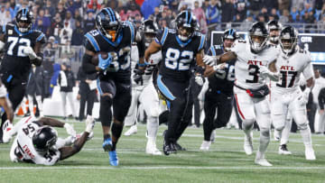 CHARLOTTE, NORTH CAROLINA - NOVEMBER 10: D'Onta Foreman #33 of the Carolina Panthers runs past Rashaan Evans #54 of the Atlanta Falcons while scoring a touchdown during the third quarter at Bank of America Stadium on November 10, 2022 in Charlotte, North Carolina. (Photo by Lance King/Getty Images)
