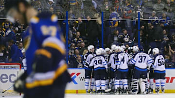 Dec 3, 2016; St. Louis, MO, USA; Winnipeg Jets center Bryan Little (not pictured) celebrates with teammates after scoring the game winning goal in overtime as St. Louis Blues defenseman Alex Pietrangelo (27) skates off the ice at Scottrade Center. The Jets won 3-2 in overtime. Mandatory Credit: Jeff Curry-USA TODAY Sports