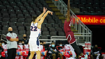 Nov 28, 2020; Kansas City, Missouri, USA; Liberty Flames forward Kyle Rode (22) shoots as South Carolina Gamecocks forward Keyshawn Bryant (24) defends during the first half at T-Mobile Center. Mandatory Credit: Jay Biggerstaff-USA TODAY Sports