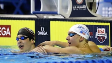 Jun 26, 2016; Omaha, NE, USA; Chase Kalisz (right) celebrates with Jay Litherland (left) after winning the men