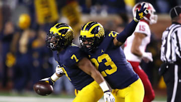 ANN ARBOR, MICHIGAN - NOVEMBER 17: Khaleke Hudson #7 of the Michigan Wolverines celebrates a second half fumble recovery with Tyree Kinnel #23 while playing the Indiana Hoosiers at Michigan Stadium on November 17, 2018 in Ann Arbor, Michigan. Michigan won the game 31-20. (Photo by Gregory Shamus/Getty Images)
