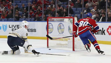 BUFFALO, NY - JANUARY 30: Tomas Tatar #90 of the Montreal Canadiens scores an empty net goal in front of Jack Eichel #9 of the Buffalo Sabres during the third period of play at the KeyBank Center on January 30, 2020 in Buffalo, New York. The Canadiens handed the Sabres their second straight loss following the All-Star break with a 3-1 win. (Photo by Nicholas T. LoVerde/Getty Images)