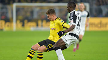 DORTMUND, GERMANY - NOVEMBER 22: Thorgan Hazard of Borussia Dortmund and Jamilu Collins of SC Paderborn 07 battle for the ball during the Bundesliga match between Borussia Dortmund and SC Paderborn 07 at Signal Iduna Park on November 22, 2019 in Dortmund, Germany. (Photo by TF-Images/Getty Images)