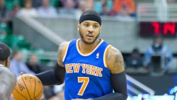 Mar 31, 2014; Salt Lake City, UT, USA; New York Knicks forward Carmelo Anthony (7) dribbles the ball during the first quarter against the Utah Jazz at EnergySolutions Arena. Mandatory Credit: Russ Isabella-USA TODAY Sports